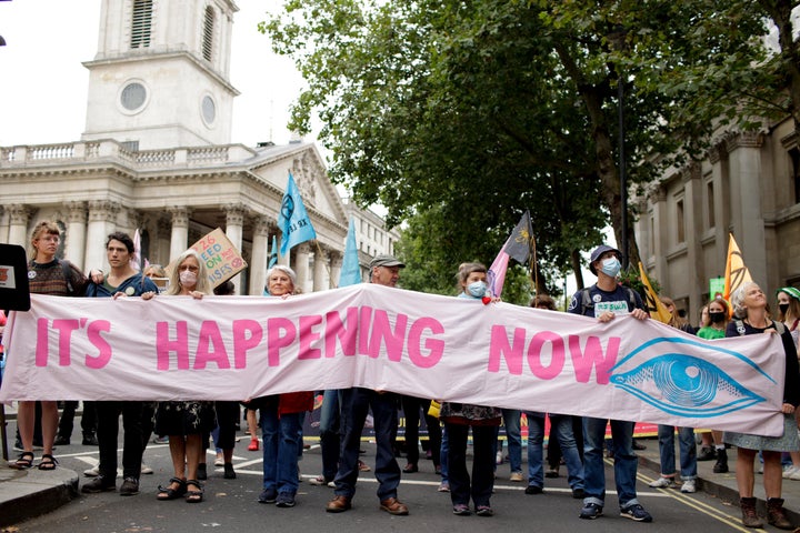 Members of climate change activist movement Extinction Rebellion march along Charing Cross Road