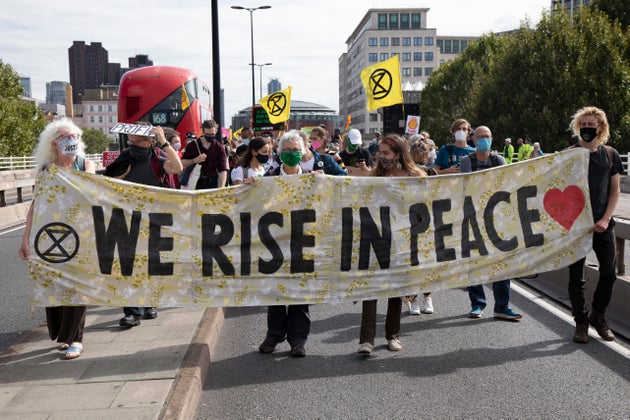 Extinction Rebellion Shell Out protest 'We rise in peace' banner on 8th September 2020 in London, United
