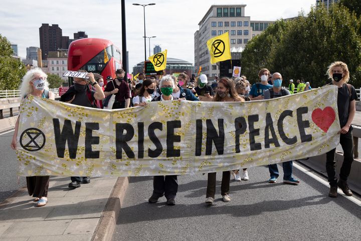 Extinction Rebellion Shell Out protest 'We rise in peace' banner on 8th September 2020 in London, United Kingdom