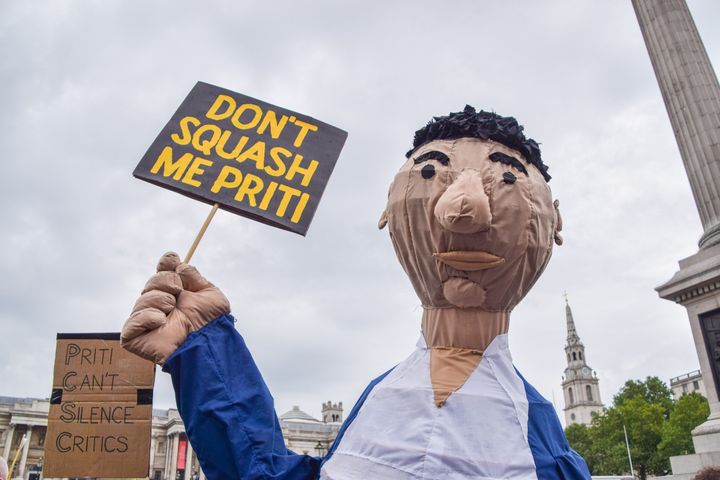 A demonstrator wearing a costume holds a placard which says 'Don't Squash Me Priti (Patel)' during the Kill The Bill protest against the Police, Crime, Sentencing and Courts Bill