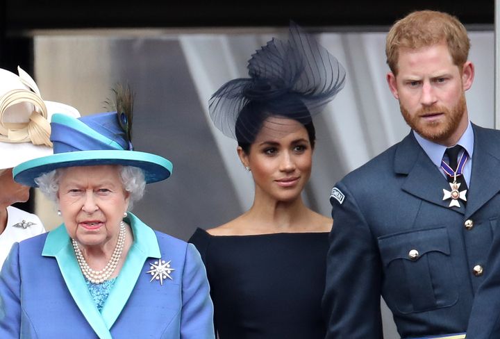 Queen Elizabeth and the Duke and Duchess of Sussex stand on the balcony of Buckingham Palace on July 10, 2018.