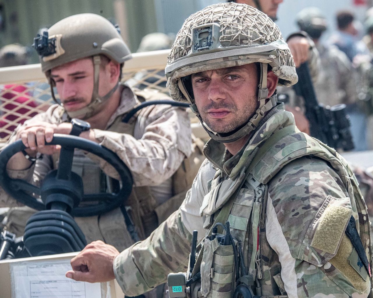 n this handout image provided by the Ministry of Defence, the British armed forces work with the U.S. military to evacuate eligible civilians out of Afghanistan on August 21, 2021 