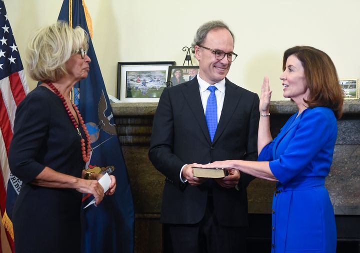 Kathy Hochul, right, became the first female governor of New York at the stroke of midnight Tuesday.