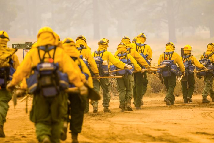 More than 13,500 firefighters were working Monday to contain a dozen large California wildfires.
