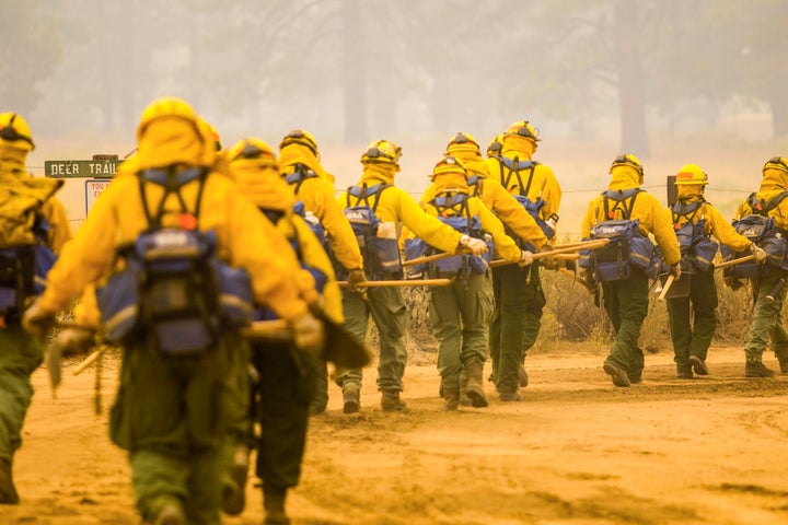 More than 13,500 firefighters were working Monday to contain a dozen large California wildfires.