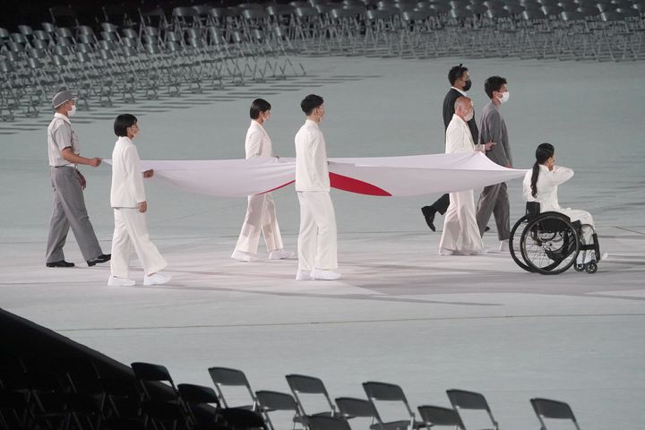 24 August 2021, Japan, Tokio: Paralympics: Opening Ceremony at the Olympic Stadium. The Japanese flag is brought into the stadium at the start of the opening ceremony of the Summer Paralympic Games. Photo: Marcus Brandt/dpa (Photo by Marcus Brandt/picture alliance via Getty Images)