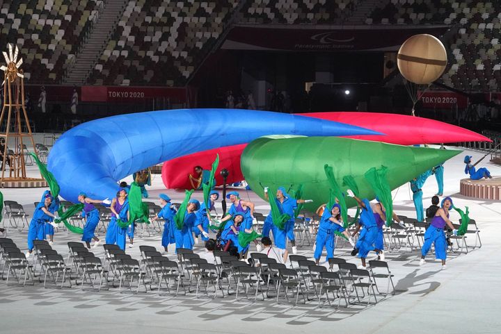 24 August 2021, Japan, Tokio: Paralympics: Opening Ceremony at the Olympic Stadium. The Paralympic symbol is held by dancers at the opening ceremony. Photo: Marcus Brandt/dpa (Photo by Marcus Brandt/picture alliance via Getty Images)