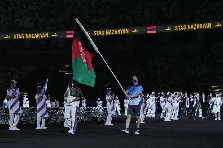 The flag of Afghanistan is carried out at the opening ceremony for the Tokyo 2020 Paralympic Games at the Olympic Stadium in Tokyo on August 24, 2021. (Photo by YASUYOSHI CHIBA / AFP) (Photo by YASUYOSHI CHIBA/AFP via Getty Images)
