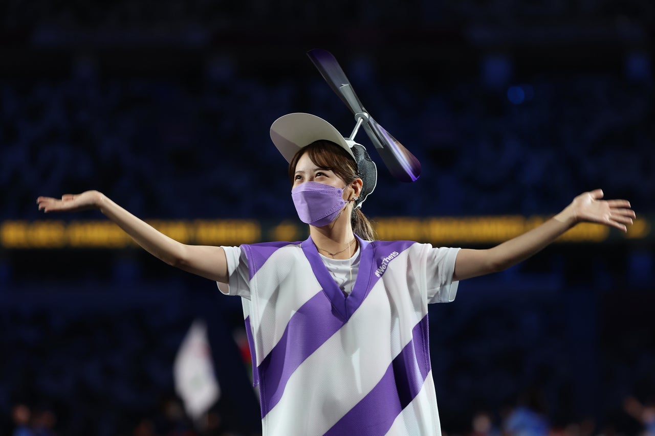 Performers welcome athletes into the National Stadium for the opening ceremony.