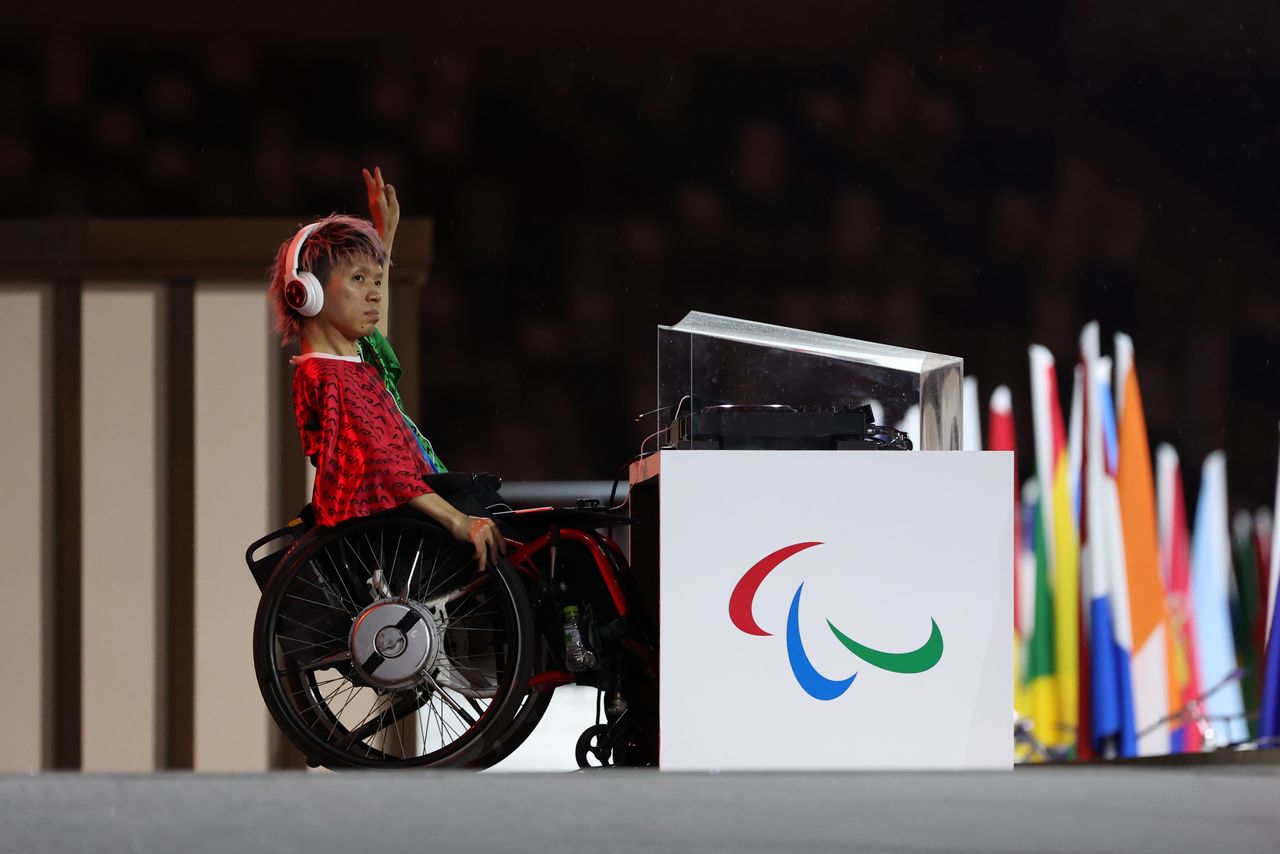 An entertainer performs during the opening ceremony of the Tokyo 2020 Paralympic Games.
