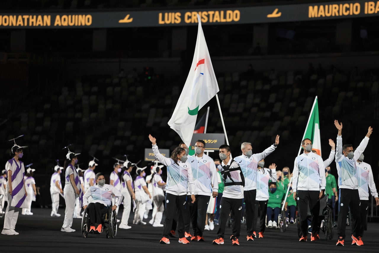 Names of athletes are displayed on the tiers between empty seats inside the Olympic Stadium.