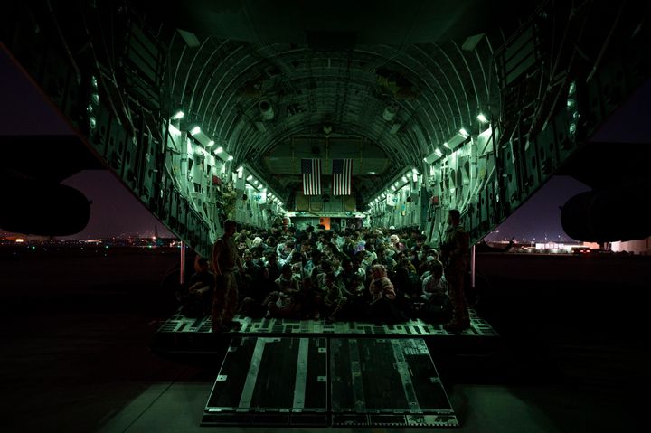 In this handout provided by the U.S. Air Force, refugees are seen aboard a C-17 Globemaster III on Aug. 21. in Kabul. Thousands are being flown out daily.