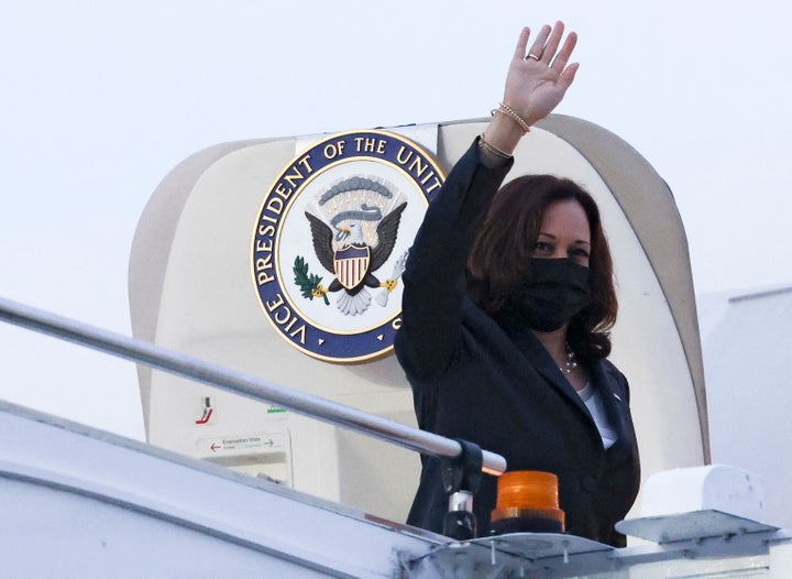 Vice President Kamala Harris waves before departing Singapore on Aug. 24.