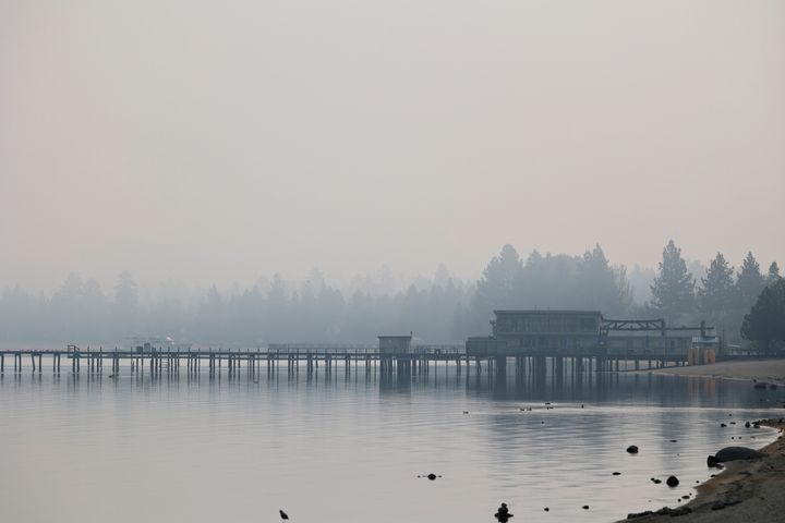 A view shows Lake Tahoe obscured by smoke from the Caldor Fire, in South Lake Tahoe, California, on August 23, 2021.