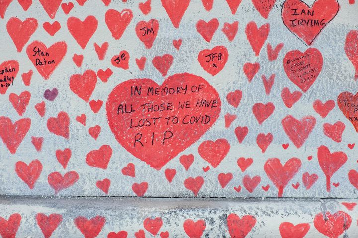 The national covid memorial wall, a sea of red love hearts remembering all those who have died due to the covid-19 pandemic. The number of people who have died within 28 days of a positive test now stands as 132,003.