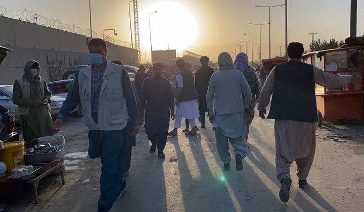 People who want to flee the country continue to wait around Hamid Karzai International Airport in Kabul, Afghanistan, on Aug. 25.