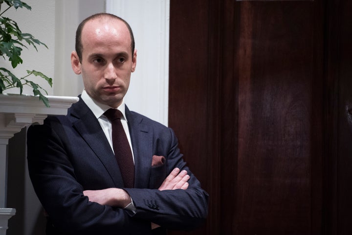 White House senior adviser Stephen Miller listens as President Donald Trump talks during a law enforcement roundtable on sanctuary cities in the Roosevelt Room at the White House on March 20, 2018, in Washington, D.C.