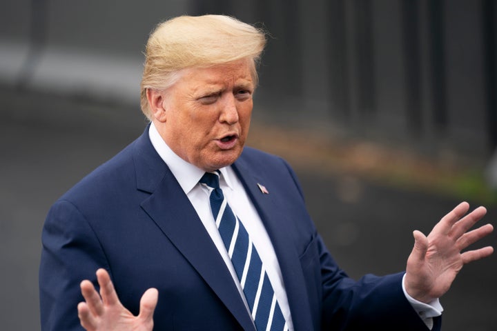 Then-President Donald Trump speaks to reporters before leaving the White House on March 3, 2020, days after reaching a deal w