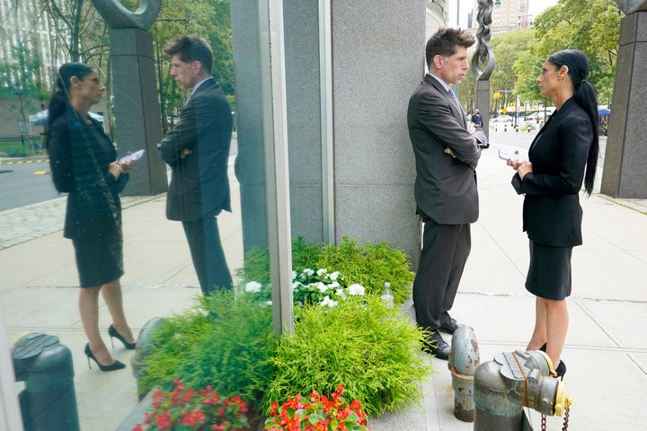 R. Kelly's attorneys Nicole Becker and Thomas Farinella talk outside the Brooklyn federal court during a break Friday in the R. Kelly trial.