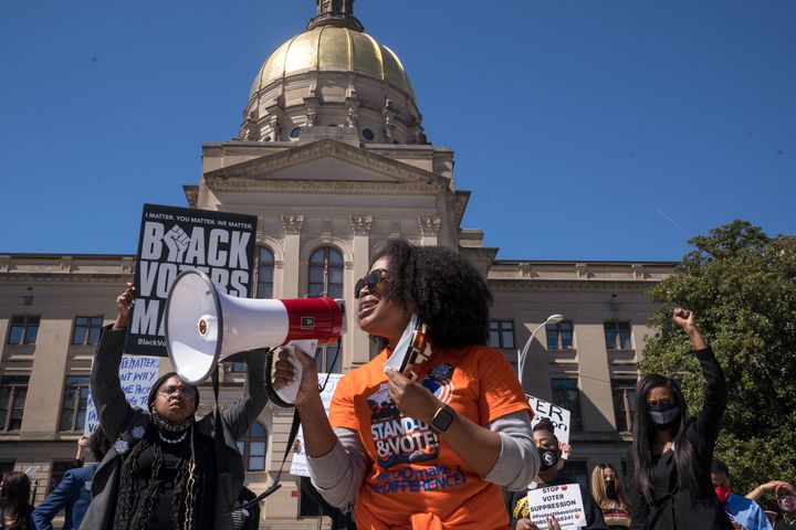 Georgia activists protested a sweeping package of voter restrictions the Republican-controlled legislature passed earlier this year. A Saturday rally in Atlanta will call attention to the new law and demand federal voting rights protections.
