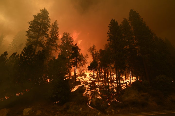 Smoke and flames rise after Caldor Fire showed a significant fire activity this afternoon along US Highway 50 near Kyburz, Ca