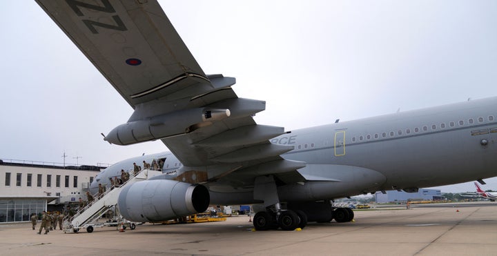 Members of the British armed forces 16 Air Assault Brigade walk to the air terminal after disembarking a Royal Airforce Voyager aircraft at Brize Norton, Oxfordshire on August 28, 2021, as the troops return from assisting with the evacuation of people from Kabul airport in Afghanistan.