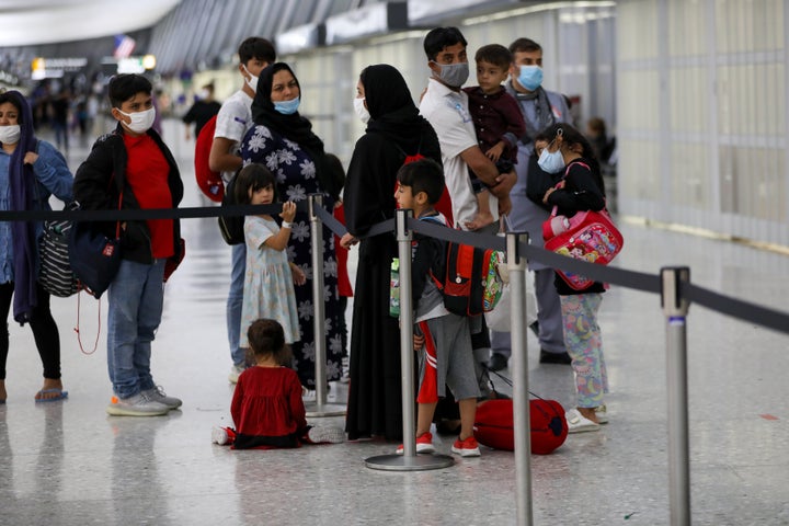 Afghan refugees evacuated from Kabul, arrive in Washington Dulles International Airport in Washington, DC, on Aug. 27.