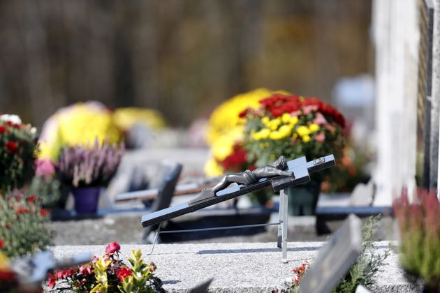 All Saints Day in a cemetery. Crucifix. Jesus on the cross.  France. (Photo by: Godong/Universal Images Group via Getty Images)