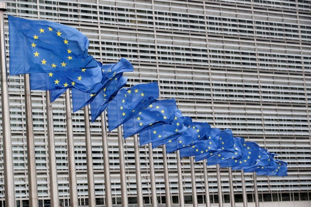 European Union flags flutter outside the EU Commission headquarters in Brussels, Belgium, July 14, 2021. REUTERS/Yves Herman