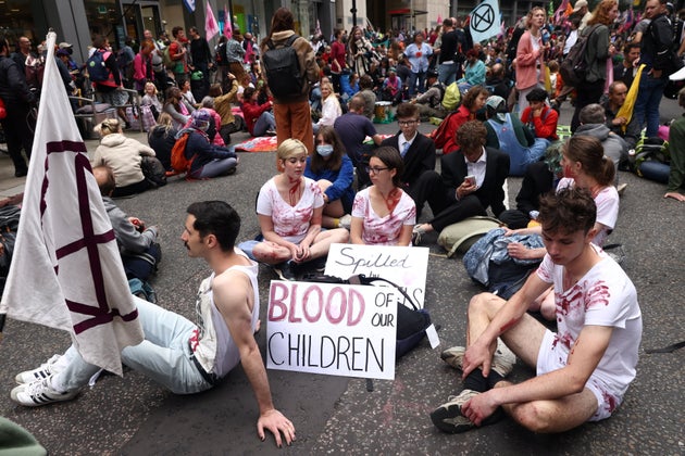 Extinction Rebellion climate demonstrators hold a sitting demonstration at Fenchurch Street in