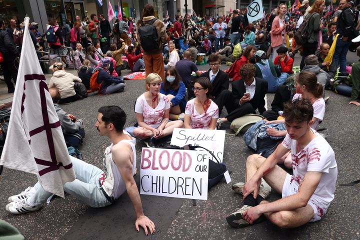 Extinction Rebellion climate demonstrators hold a sitting demonstration at Fenchurch Street in London.