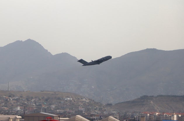 A US military aircraft takes off from the Hamid Karzai International Airport in