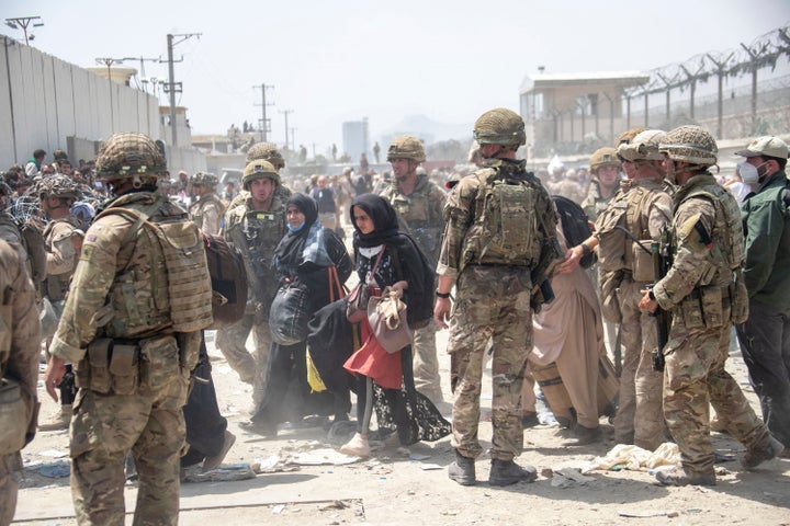 <strong>Members of the British and US military engage in the evacuation of people out of Kabul, Afghanistan.</strong>