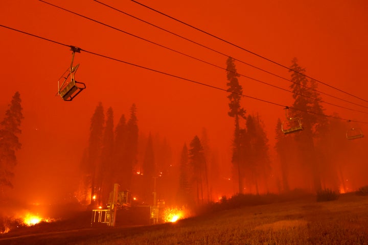 A chairlift at Sierra-at-Tahoe ski resort sits idle Monday as the Caldor fire moves through the Twin Bridges, California, are