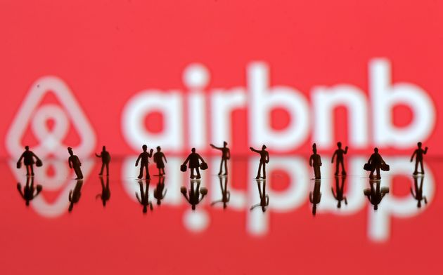 A 3D printed people's models are seen in front of a displayed Airbnb logo in this illustration taken, June 8, 2016. REUTERS/Dado Ruvic/Illustration TPX IMAGES OF THE DAY 