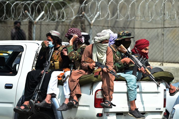 Taliban fighters guard outside the airport in Kabul on August 31, 2021.