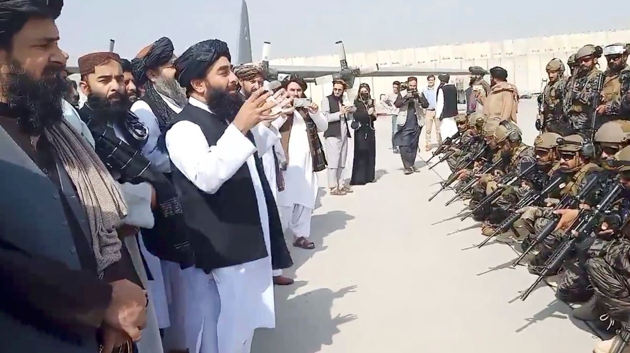 Taliban spokesman Zabihullah Mujahid speaks to Badri 313 military unit at Kabul's airport.