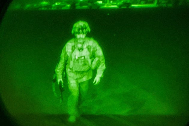 US Army Major General Chris Donahue, commander of the 82nd Airborne Division, steps on board a C-17 transport