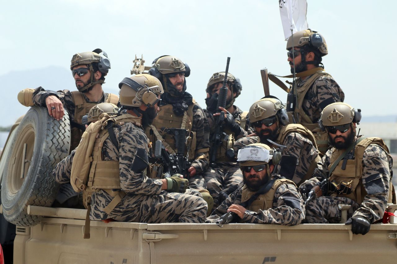 Taliban special forces fighters arrive inside the Hamid Karzai International Airport after the US military's withdrawal.