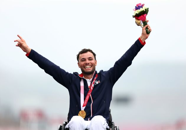 Tokyo 2020 Paralympic Games - Cycling Road - Men's H1-2 Road Race - Medal Ceremony - Fuji International Speedway, Shizuoka, Japan - September 1, 2021. Gold Medallist Florian Jouanny of France celebrates on the podium REUTERS/Lisi Niesner