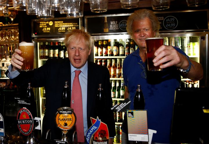 Brexit-backing Boris Johnson and Brexit supporter JD Wetherspoon chairman Tim Martin pictured at Wetherspoons Metropolitan Bar in London, Britain, July 10, 2019. 