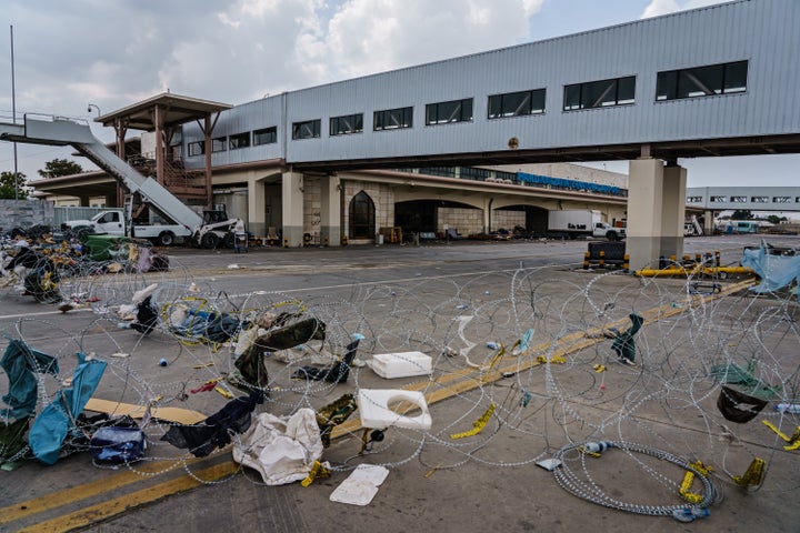 Scenes around the abandoned airport area where civilians were processed for evacuations.