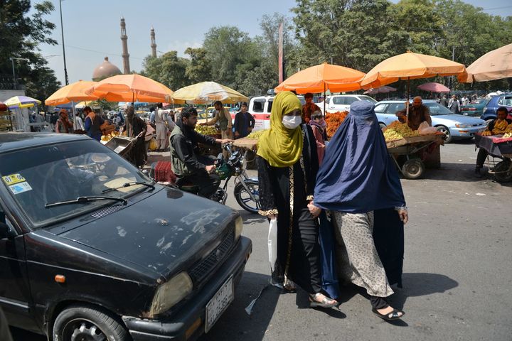 Women walk at a market area in Kabul on September 1, 2021. (Photo by HOSHANG HASHIMI / AFP) (Photo by HOSHANG HASHIMI/AFP via Getty Images)