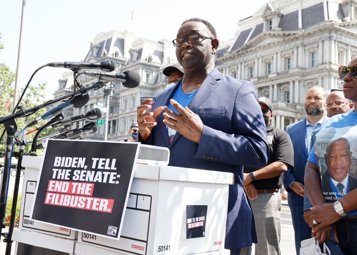 Henry Lewis, the brother of the late Rep. John Lewis (D-Ga.), helps with delivering a petition to the White House calling on President Joe Biden to leverage the power of his office and publicly urge the Senate to end the filibuster to pass voting rights legislation.