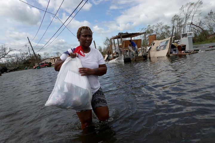 Dina Lewis rescues items from her home after it was destroyed by Hurricane Ida on Monday in LaPlace, Louisiana. Ida made landfall Sunday as a Category 4 storm southwest of New Orleans.