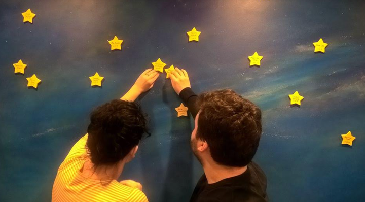 The author and Zach place stars with the twins’ names at the Mothers’ Milk Bank of the Western Great Lakes, where the author