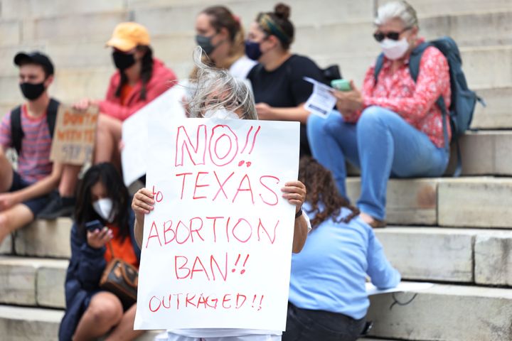 A woman in New York protesting after the new Texas abortion law was passed