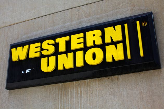 A Western Union sign is seen in New York March 28, 2009. Picture taken March 28, 2009. REUTERS/Eric Thayer...