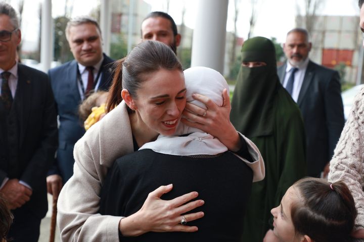 Jacinda Ardern consoling a grieving woman after the 2019 attacks