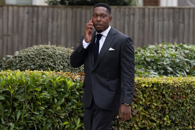 The rapper was seen talking on his phone as he made his way into